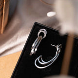 Brincos Pendente Curvas Em Ouro Branco Com Diamantes