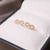 Brincos Stud Infinito Em Ouro Amarelo E Safiras