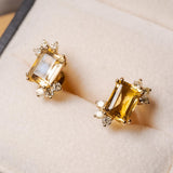 Brincos Flora em ouro amarelo com citrinos e diamantes.