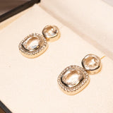 Brincos Hstern Heritage em ouro nobre com cristais de rocha e diamantes brilhantes.