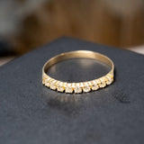 Anel meia aliança em ouro amarelo com 9 diamantes fancy color de 0.3 pontos cada e peso de 1.0g. Aro 19.