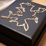 Colar de corrente ouro rosê malha cingapura com 45cm de comprimento e 0.1cm de espessura. Peso 1.8g.