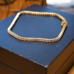 Pulseira riviera em ouro amarelo com 83 diamantes brilhantes de 0.04 pontos cada totalizando 2.49ct