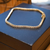 Pulseira riviera em ouro amarelo com 83 diamantes brilhantes de 0.04 pontos cada totalizando 2.49ct