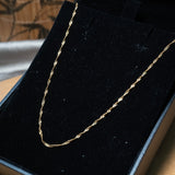Colar cordão malha singapura em ouro amarelo com 56cm de comprimento e 0.1cm de espessura