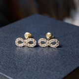 Brincos Stud Infinito Em Ouro Amarelo E Safiras