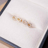 Brincos Stud Infinito Em Ouro Amarelo E Safiras